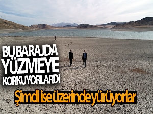 Yüzmeye korktukları barajın üzerinde yürüyorlar