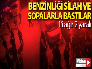 Yaklaşık 10 kişilik grubun benzinliği silah ve sopalar ile bastığı anlar kamerada