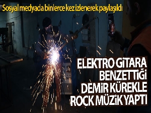 Elektro gitara benzettiği demir kürekle rock müzik yaptı