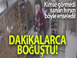 Hırsız ile işyeri sahibi arasında yaşanan arbede anları kameraya yansıdı