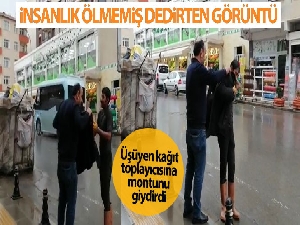 Yağmurda ıslanan kağıt toplayıcısına montunu hediye etti