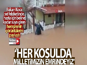 Bakan Koca, sel felaketinde hasta için beline kadar suya giren hemşirenin görüntülerini paylaştı