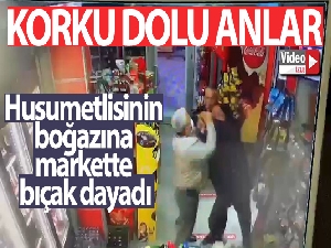 Husumetlisinin boğazına markette bıçak dayadı
