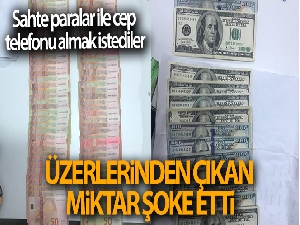 Sahte paralar ile cep telefonu almak istediler: Üzerlerinden çıkan miktar şoke etti