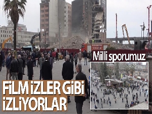 Binaların yıkılmasını film izler gibi izliyorlar