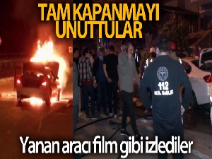 Ataşehir'de tam kapanmayı unutan vatandaşlar alev alev yanan lüks aracı film izler gibi izledi