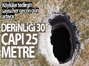 Tarla ortasında oluşan dev obruk köylüleri tedirgin ediyor