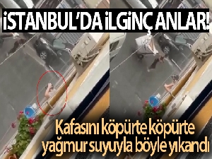 Kafasını köpürte köpürte yağmur suyuyla böyle yıkandı