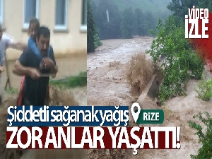 Evden yola ip çekerek dere gibi akan suyun içerisinden geçtiler