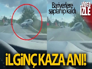 Kontrolden çıkan otomobil bariyerlerde asılı kaldı