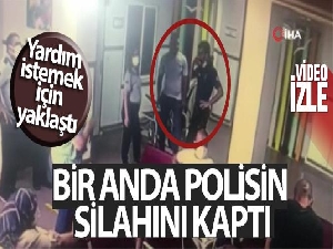 Yardım istediği polisin silahını kaptı