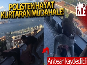 Teras kattan atlamaya çalışan genci polis anlık müdahaleyle kurtardı