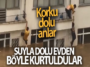 Evleri suyla dolan çift komşularının uzattığı ip yardımıyla hayata tutundu