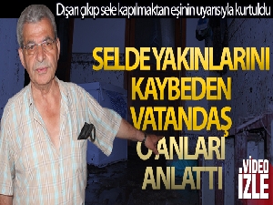 Dışarı çıkıp sele kapılmaktan eşinin uyarısıyla kurtuldu