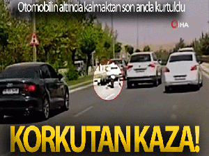 Otomobilin altında kalmaktan son anda kurtuldu
