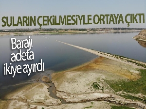 Suların çekilmesiyle ortaya çıkan demir yolu, barajı adeta ikiye ayırdı