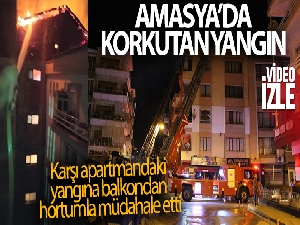 Karşı apartmandaki yangına balkondan hortumla müdahale etti