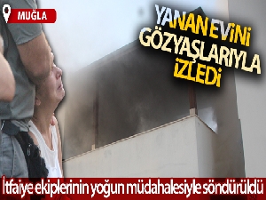 Evindeki yangını gözyaşlarıyla izledi