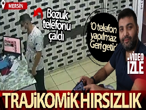 Girdiği dükkanda masadaki telefonu çaldı, o anlar kameraya yansıdı