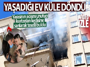 Yaşadığı ev küle döndü, yarasının acısını unutup kurtarılan kedisine sarılarak teselli buldu