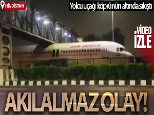 Hindistan'da köprünün altında sıkışan yolcu uçağı viral oldu