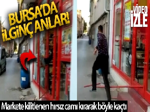Bursa'da markete kilitlenen hırsız camı kırarak böyle kaçtı