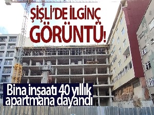 Şişli'de ilginç görüntü: Bina inşaatı 40 yıllık apartmana dayandı