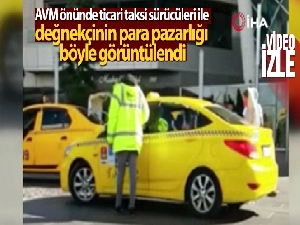 AVM önünde ticari taksi sürücüleri ile değnekçinin para pazarlığı kamerada