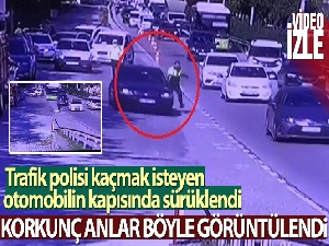 Trafik polisi kaçmak isteyen otomobilin kapısında böyle sürüklendi
