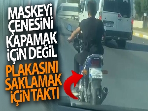 Ehliyetsiz motosiklet sürücüsünün maskeyi taktığı yeri görenler şaşkınlık yaşadı