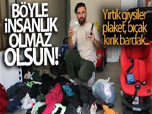 Yardım kolisinden kırık bardak, plaket ve yırtık giysi çıktı