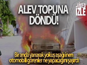 Alev topuna dönen otomobilin freni boşalınca panik yaşandı