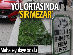 Yol ortasında 'sır mezar' mahalleliyi ikiye böldü