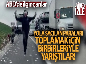 Yola saçılan paraları toplamak için birbirleriyle yarıştılar