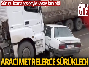 Tır otomobili metrelerce sürükledi