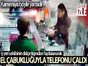 Girdiği dükkanda el çabukluğuyla telefon çaldı, o anlar kameraya yansıdı