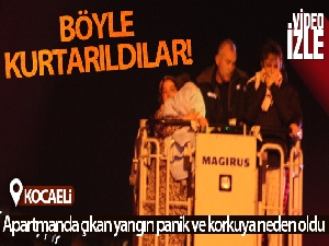 Apartman yangınında mahsur kalan 2'si bebek 14 kişi merdivenli araçla kurtarıldı