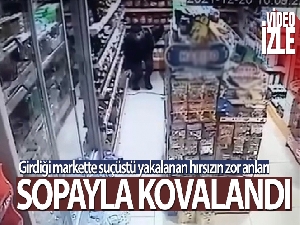Markete giren hırsız, iş yeri sahibi tarafından sopayla kovalandı
