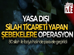 Otomobillerin bagajından 80 silah ile balya halinde para ele geçirildi