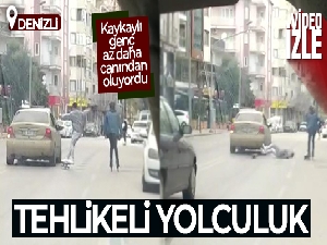 Otomobile tutunan kaykaylı genç az daha canından oluyordu