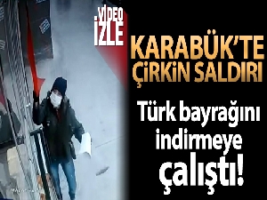 İş yerindeki Türk bayrağını indirmeye çalışan kadın kameraya yakalandı