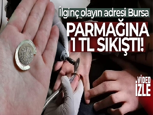 Bursa'da ilginç olay: Parmağına 1 TL sıkıştı