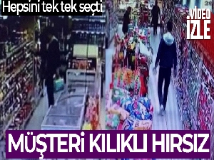 Markette ürünleri seçerek çalan hırsız kamerada
