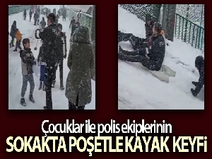 Çocuklar ile polis ekiplerinin sokakta poşetle kayak keyfi
