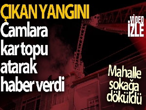 Çıkan yangını daire camlarına kar topu atarak haber verdi