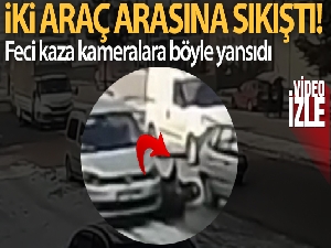 Motosiklet sürücüsünün iki araç arasına sıkıştığı kaza kamerada