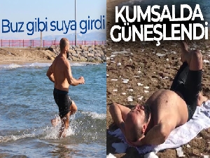 Buz gibi suya girip kumsalda güneşlendi