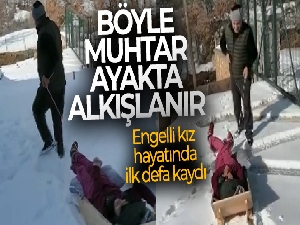 Engelli kız muhtarın yaptığı kızakla hayatında ilk defa kaydı
