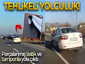 Parçalanmış lastikleri ve yerdeki tampon ile yoluna devam etti