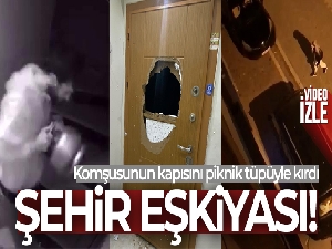Komşusunun kapısını piknik tüpüyle kırdı